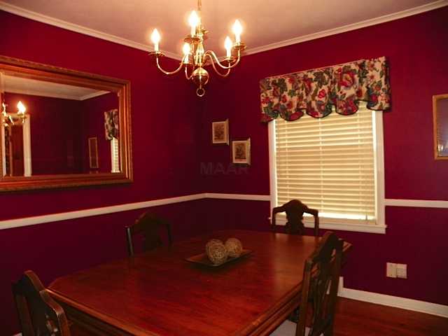 178 North Yates Road Memphis, TN 38120 - Photo 7 of 12 a view of a dining room with furniture and chandelier