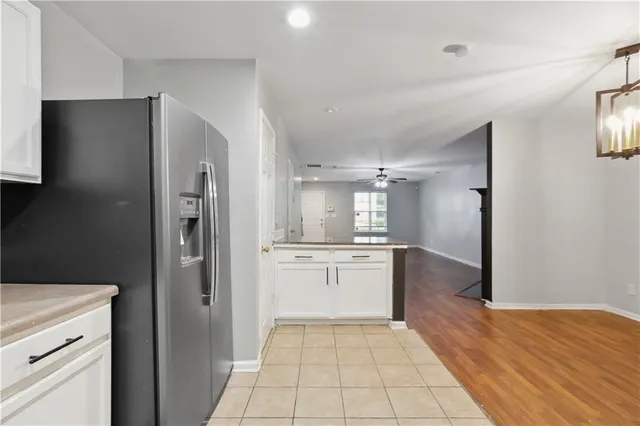 a kitchen with a refrigerator and a sink