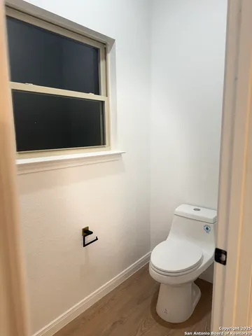 a bathroom with a toilet and a