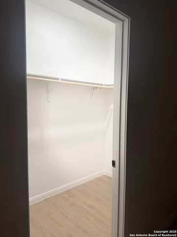 a view of an empty walk in closet