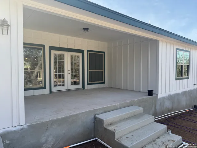 a living room with furniture and windows