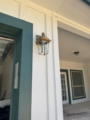 a view of wooden fence of a house