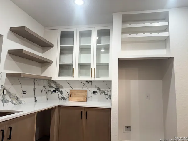 a kitchen with a sink and a window