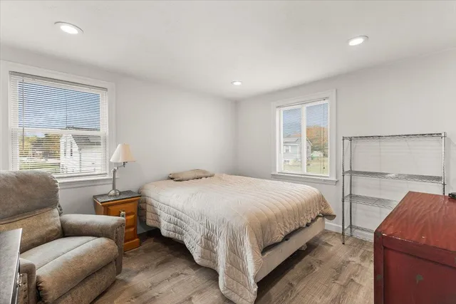 a bedroom with a bed and window