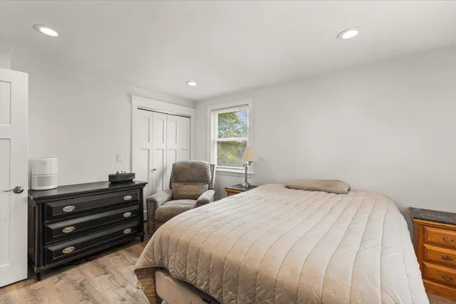 a bedroom with a bed and a dresser