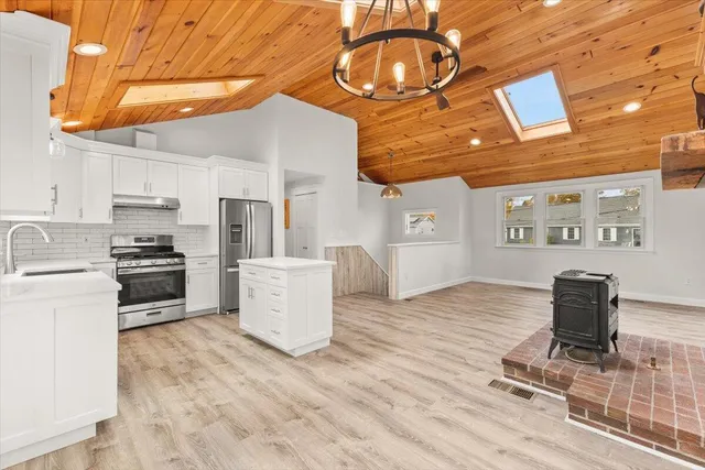 a kitchen with a appliances and cabinets