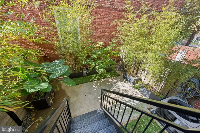a view of a balcony with wooden floor