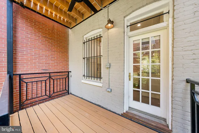 a view of a balcony with wooden floor