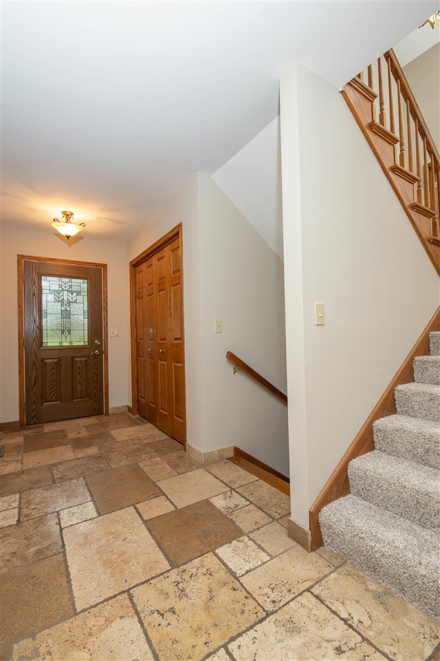 2976 West Forest Road Freeport, IL 61032 - Photo 3 of 35 a view of entryway with stairs and a window