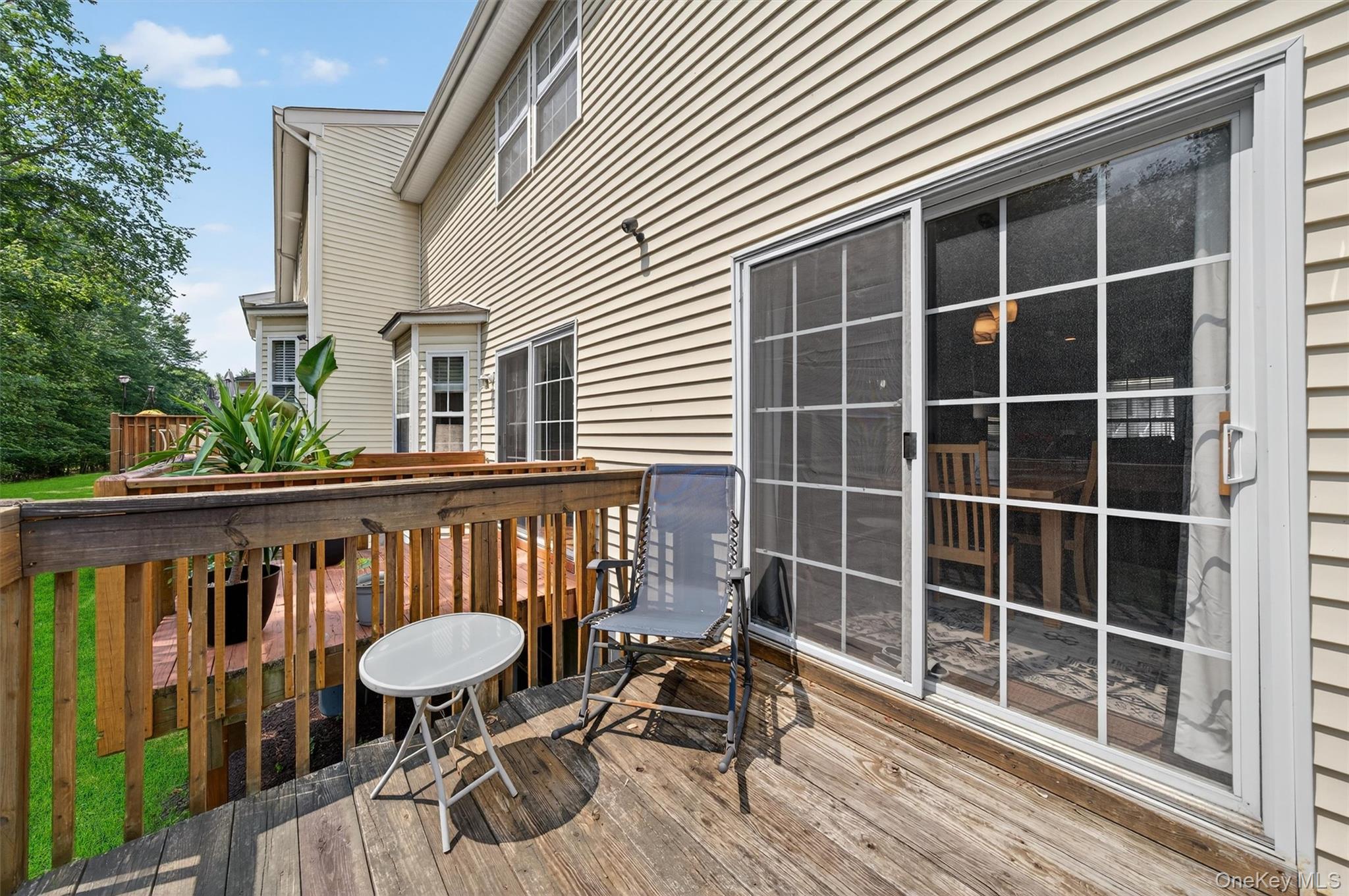 1 Lake Ridge Drive Middletown, NY 10940 - Photo 35 of 44 a view of a deck with wooden floor and outdoor seating