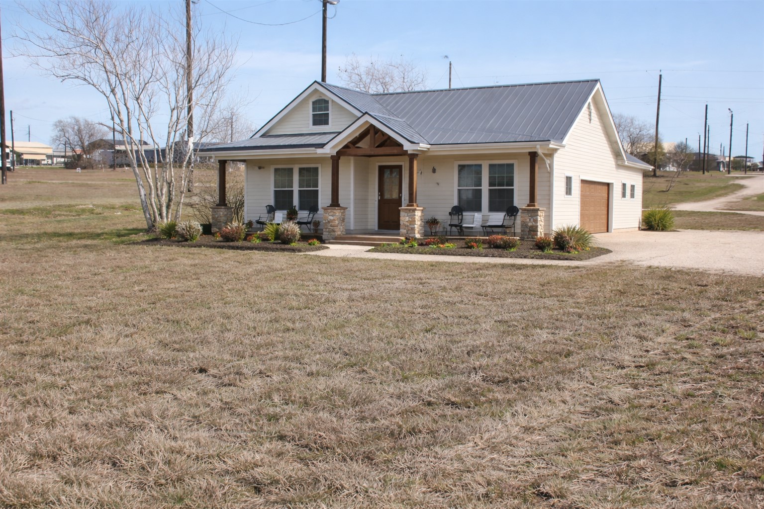 52 Baracuda Drive Palacios, TX 77465 - Photo 2 of 14 a front view of a house with swimming pool having outdoor seating