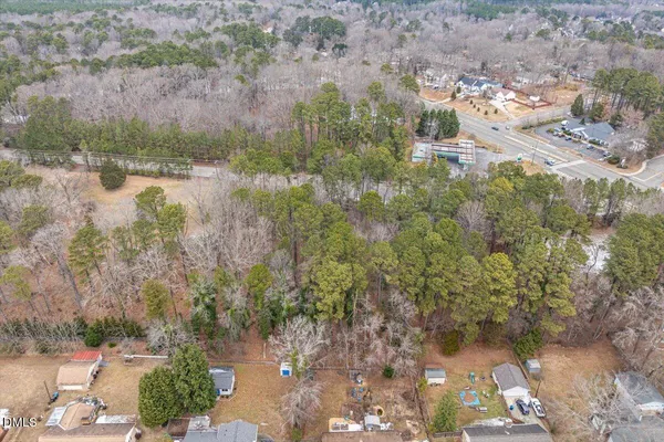 a view of a forest with a yard