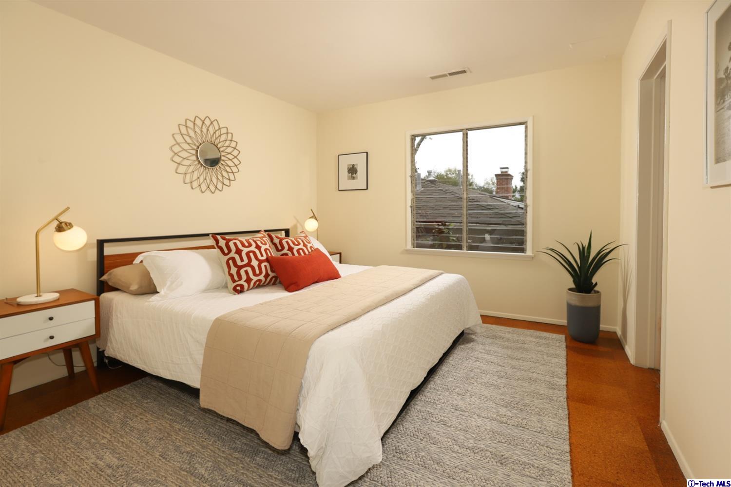 1350 Selvas Place Glendale, CA 91208 - Photo 12 of 30 a bedroom with bed and a large window