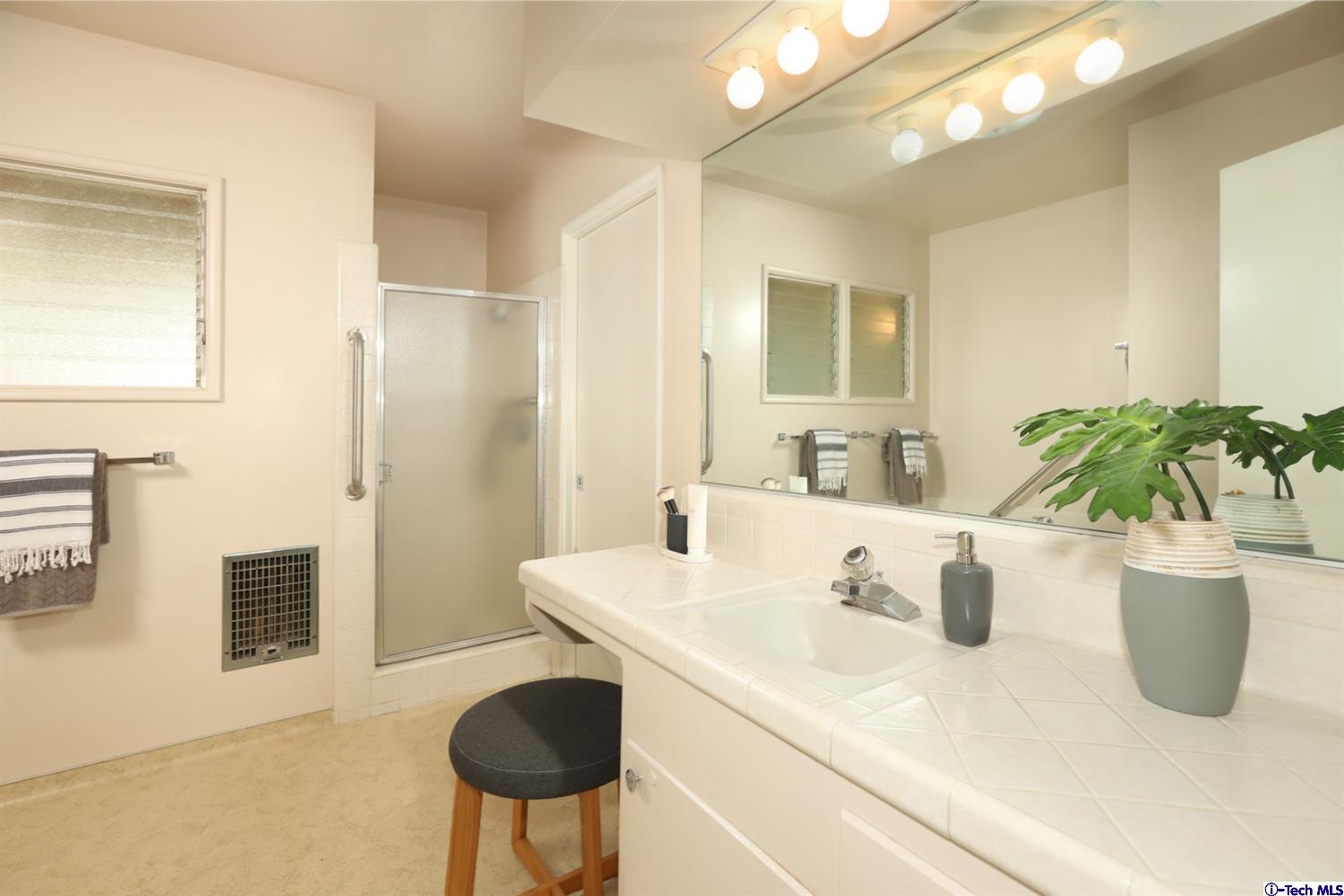 1350 Selvas Place Glendale, CA 91208 - Photo 15 of 30 a bathroom with a sink a toilet and shower