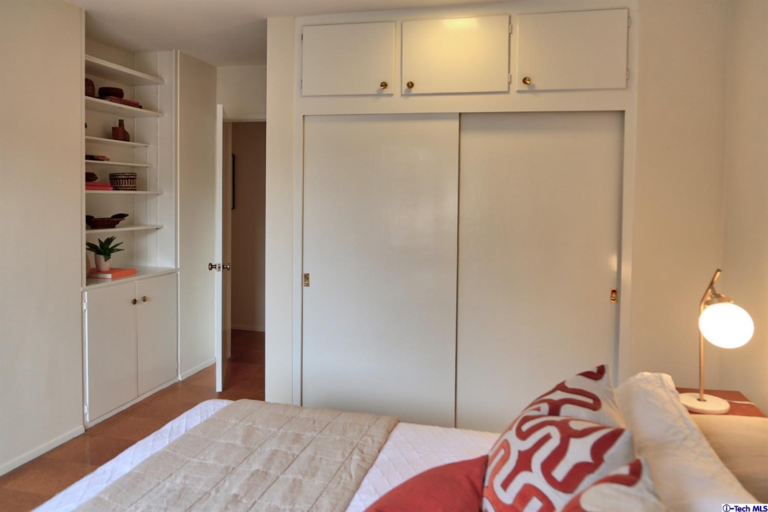 1350 Selvas Place Glendale, CA 91208 - Photo 16 of 30 a bedroom with a bed and cabinets