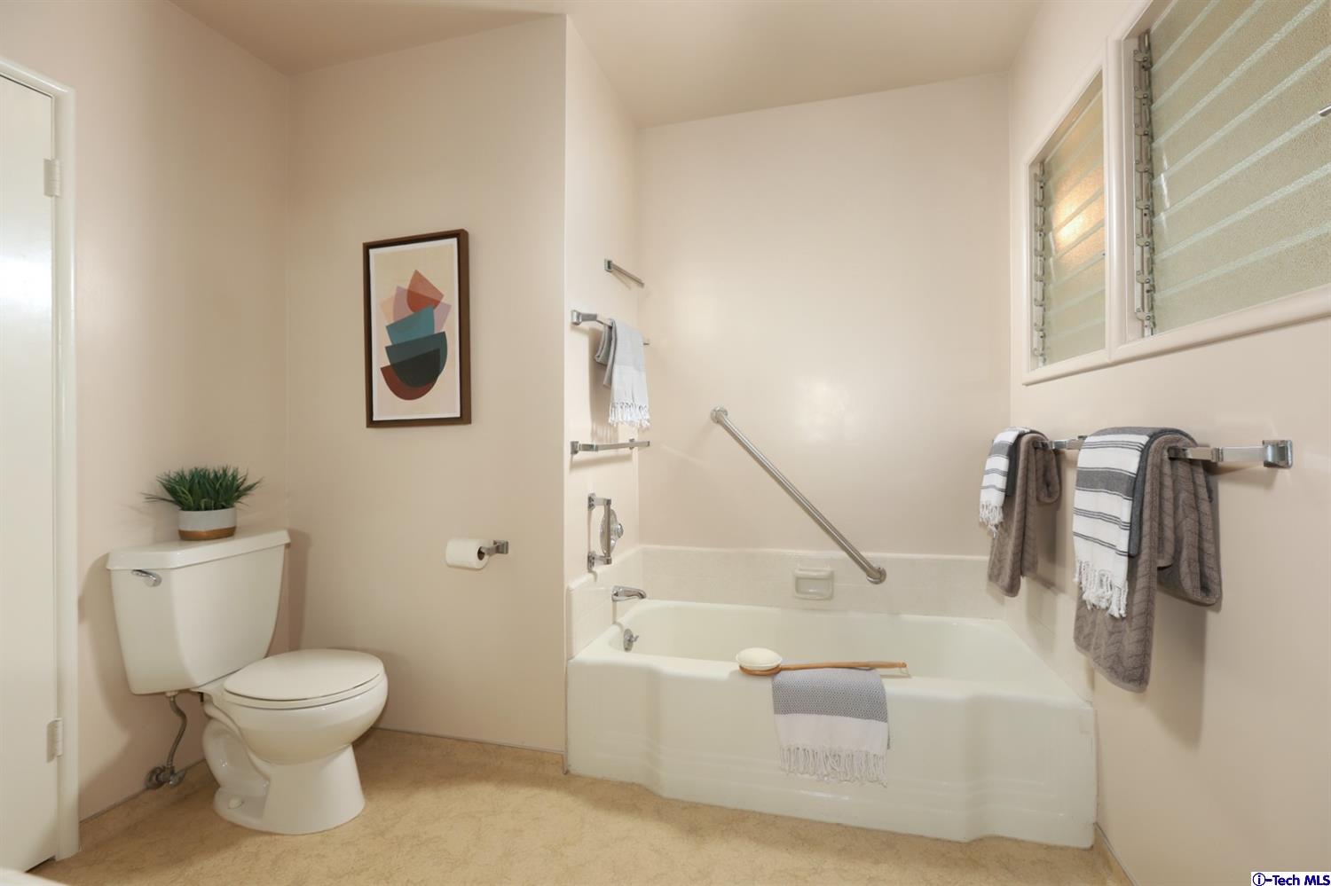 1350 Selvas Place Glendale, CA 91208 - Photo 18 of 30 a bathroom with a toilet and a bathtub