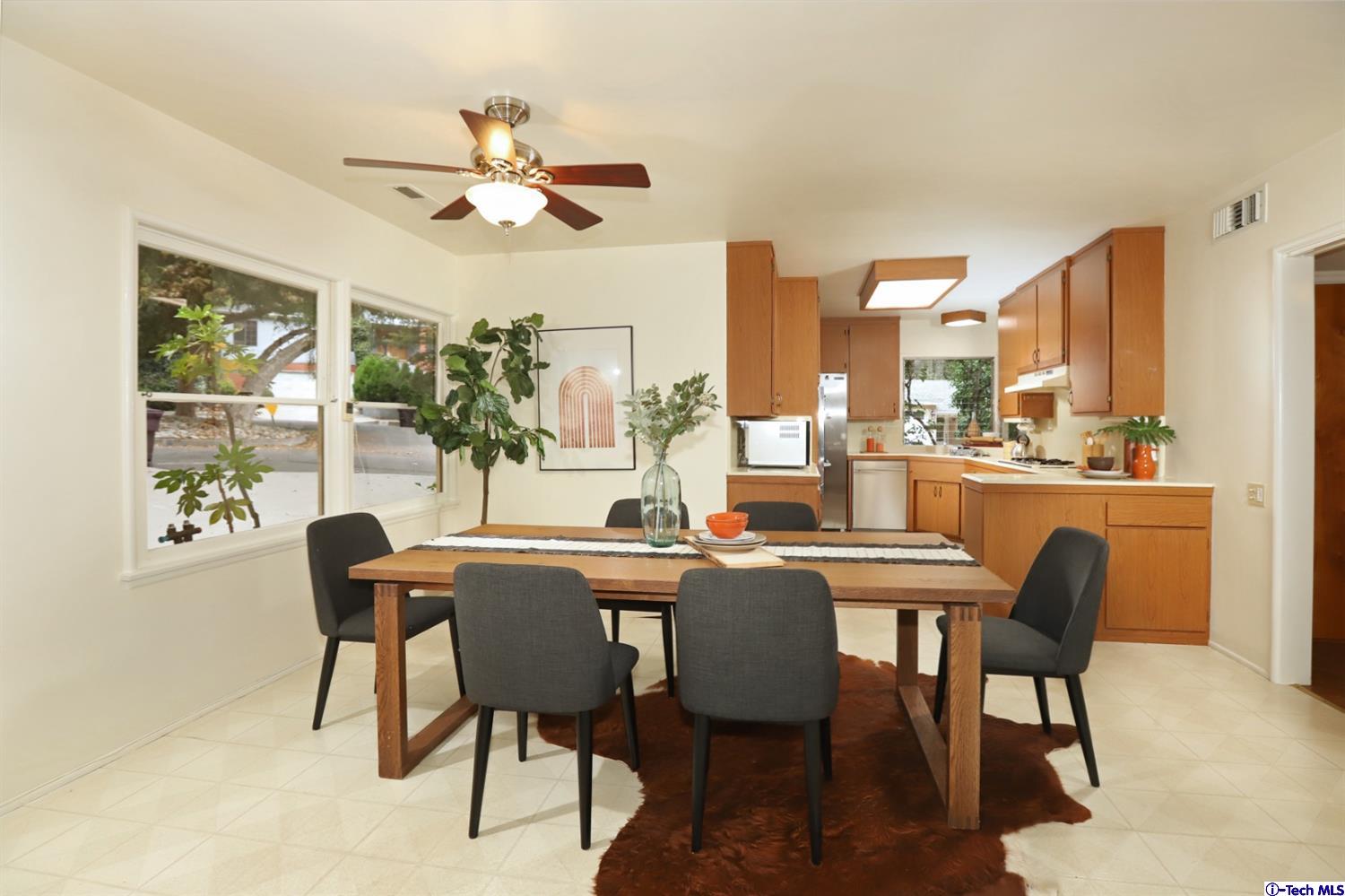 1350 Selvas Place Glendale, CA 91208 - Photo 19 of 30 a dining room with furniture a chandelier and a rug