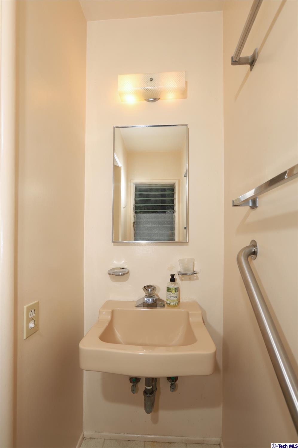 1350 Selvas Place Glendale, CA 91208 - Photo 24 of 30 a bathroom with a sink and a mirror