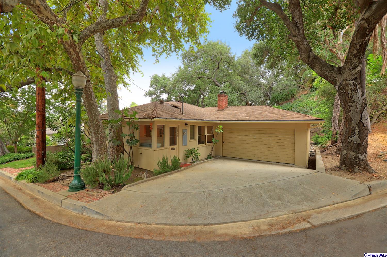 1350 Selvas Place Glendale, CA 91208 - Photo 25 of 30 a view of a house with a yard and large tree