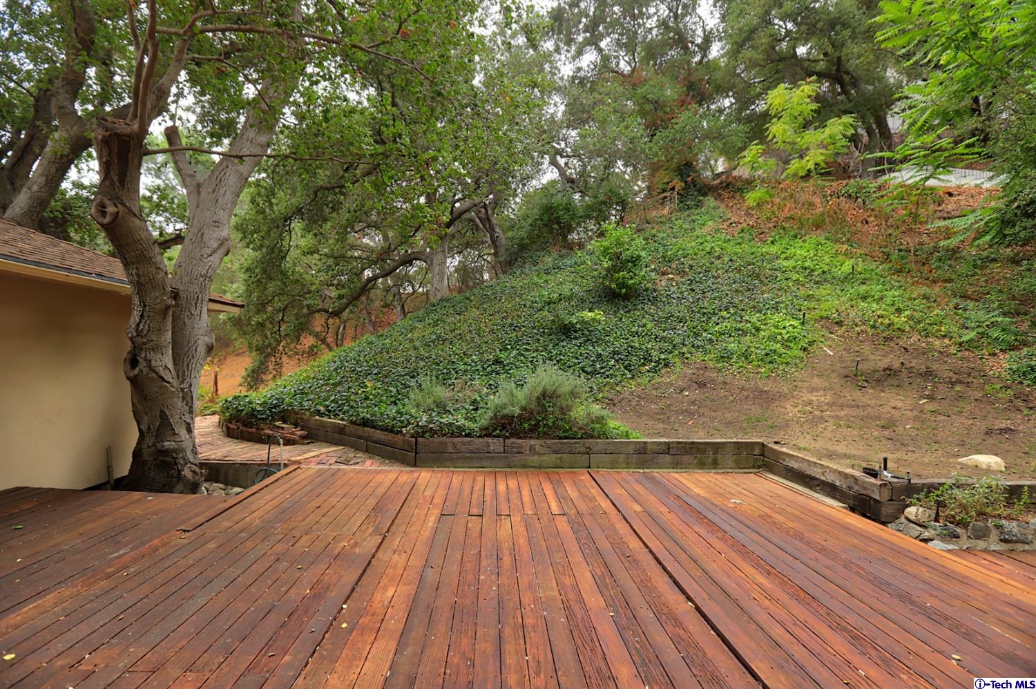 1350 Selvas Place Glendale, CA 91208 - Photo 27 of 30 a view of outdoor space with wooden floor and trees