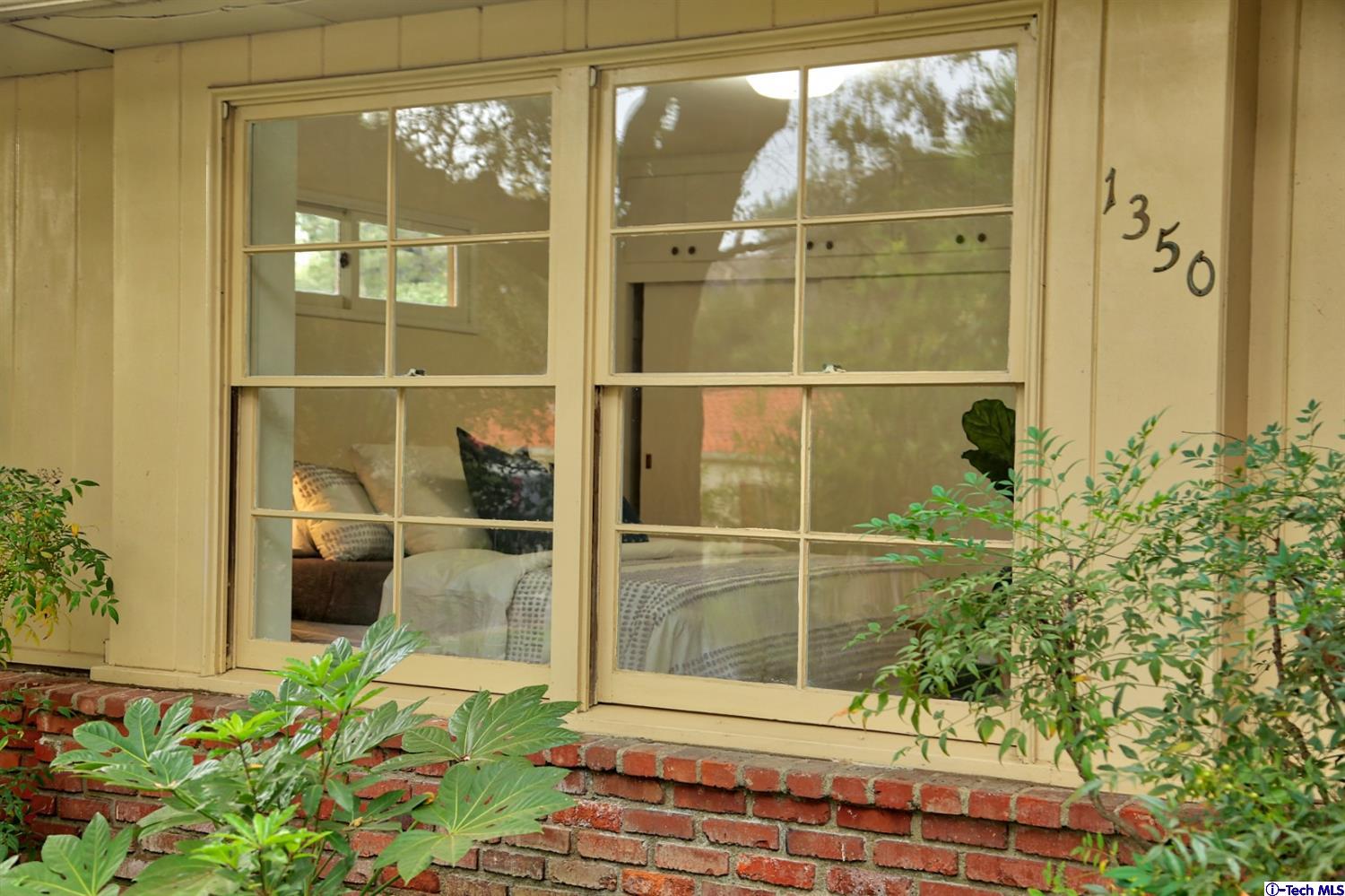1350 Selvas Place Glendale, CA 91208 - Photo 30 of 30 a bathroom with a glass door shower and a window