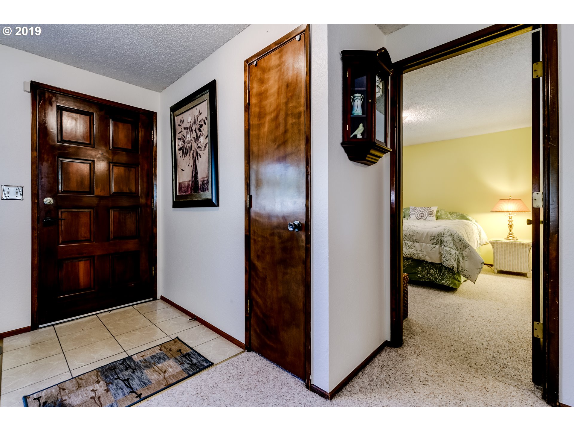 537 66th Street Springfield, OR 97478 - Photo 11 of 32 a view of a hallway and a livingroom with furniture