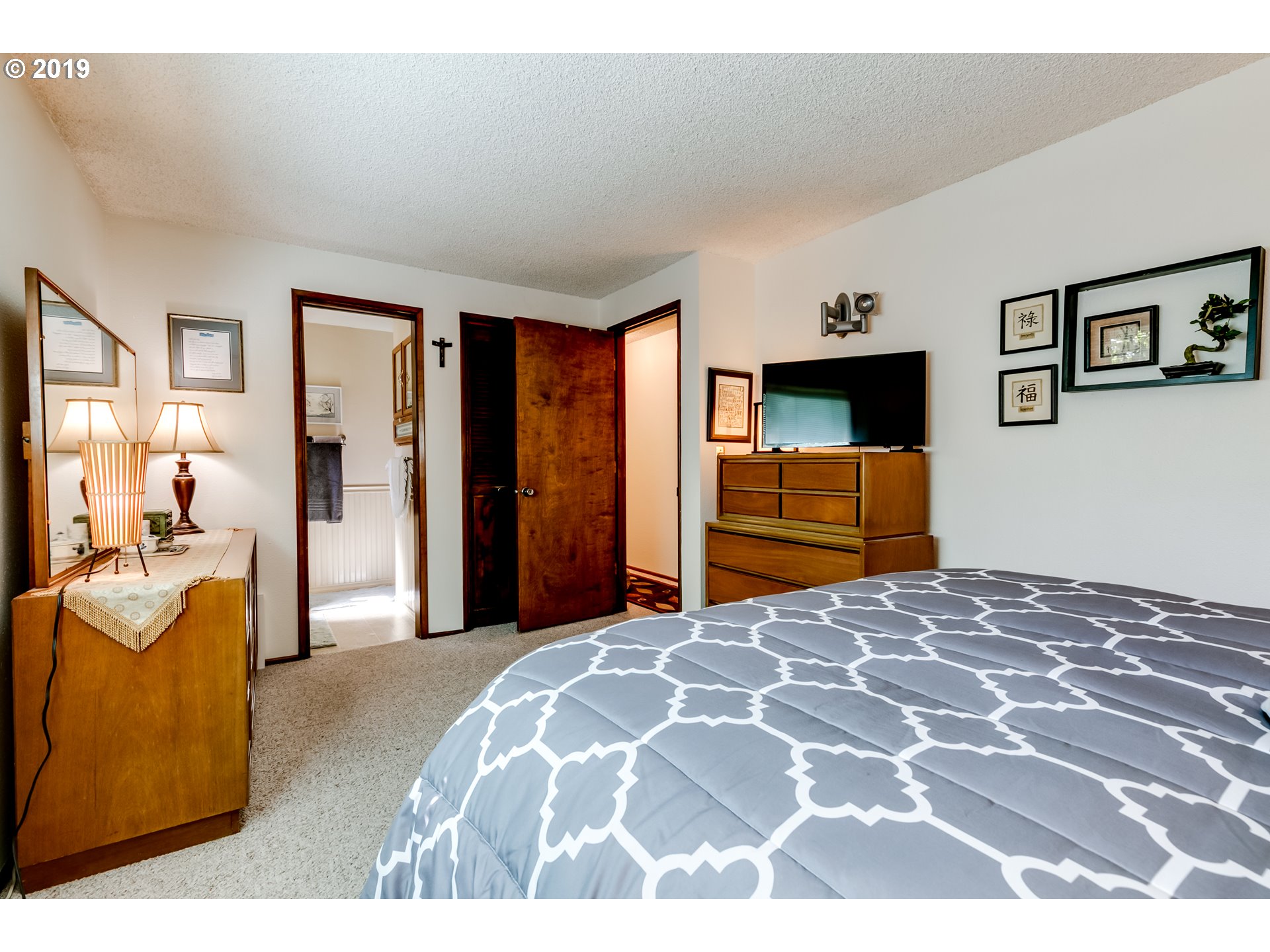 537 66th Street Springfield, OR 97478 - Photo 15 of 32 a bedroom with a bed and dresser