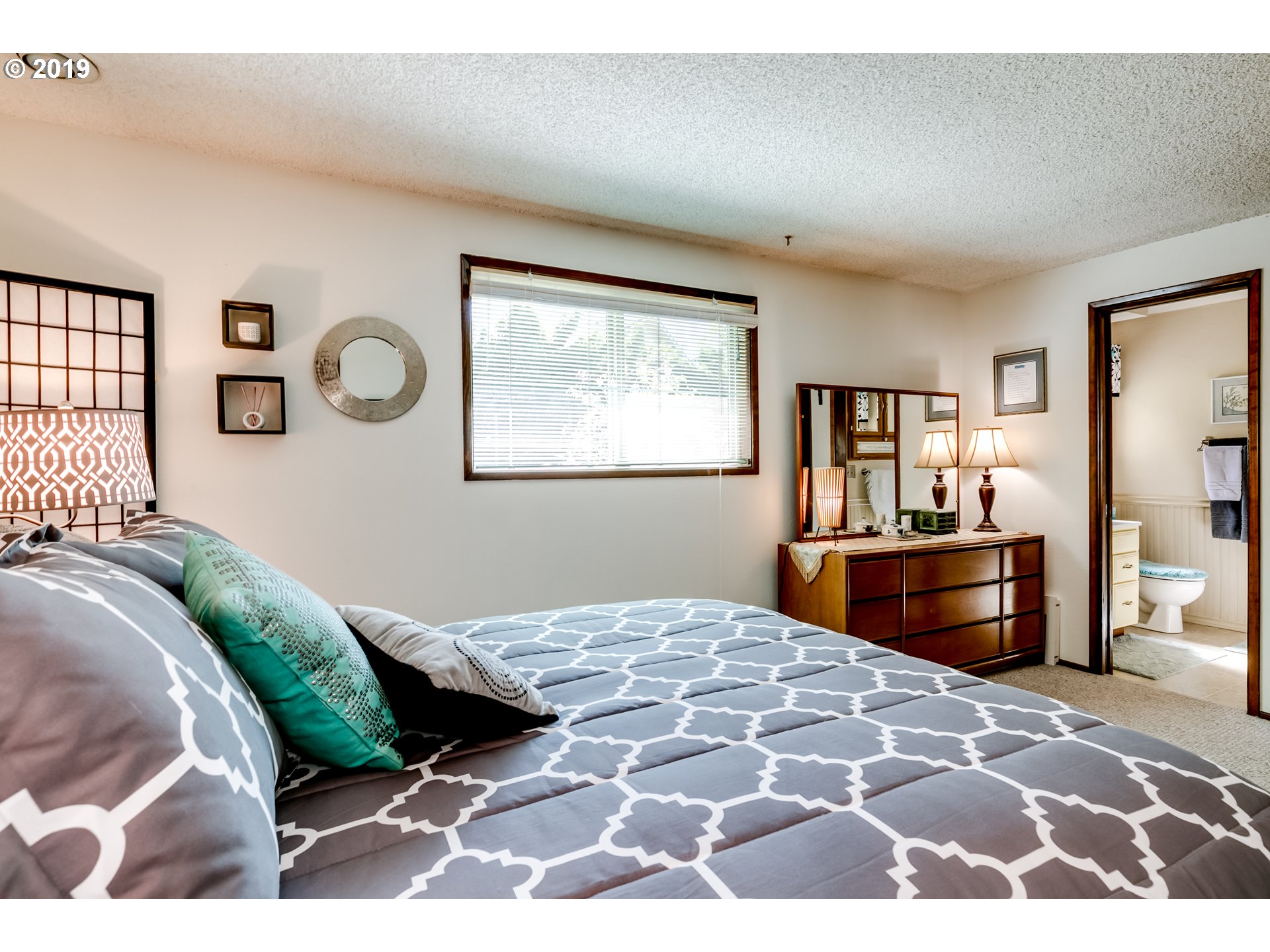 537 66th Street Springfield, OR 97478 - Photo 16 of 32 a bedroom with a large bed and a window