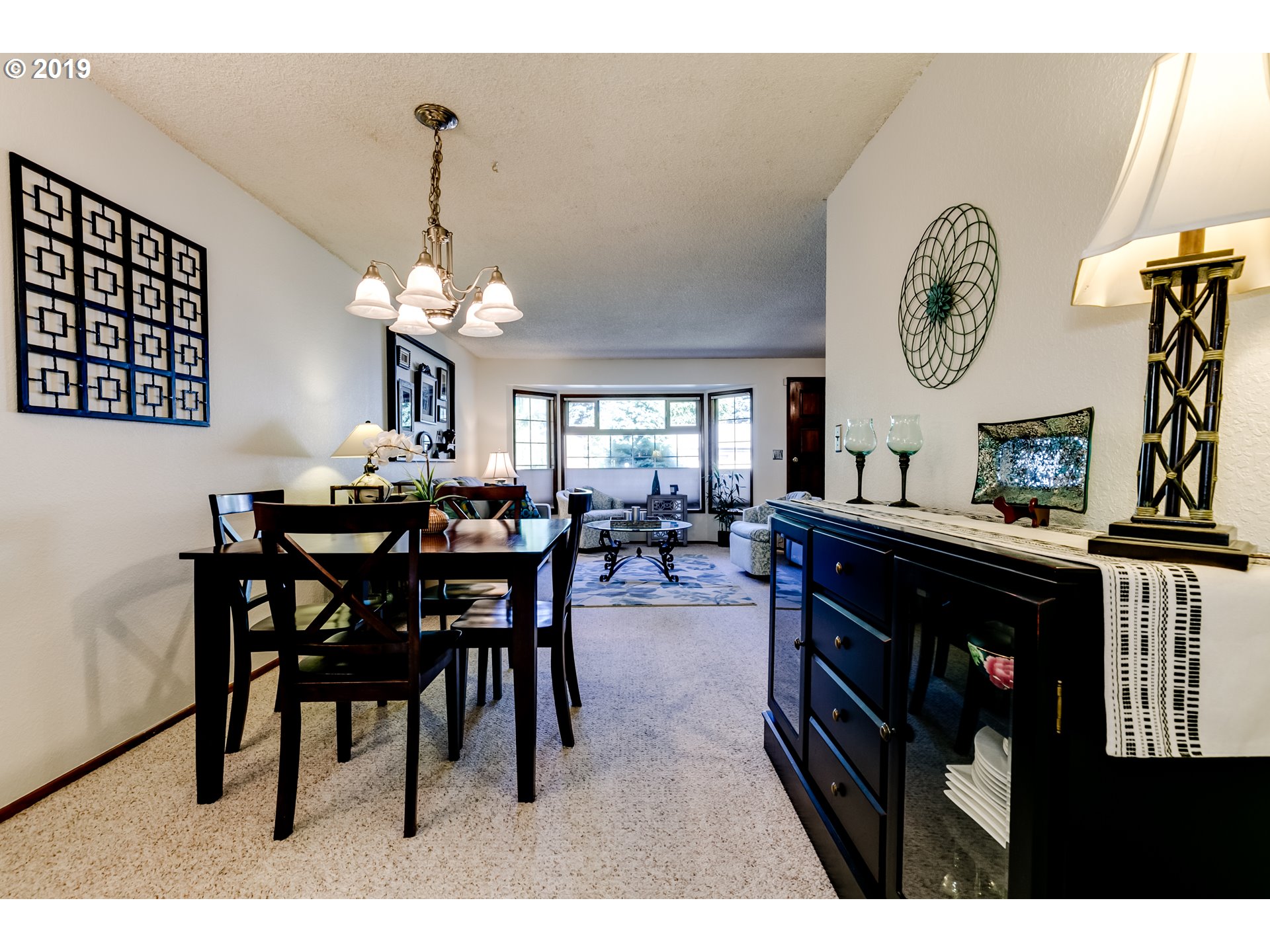 537 66th Street Springfield, OR 97478 - Photo 5 of 32 a dining room with a wooden table and chairs