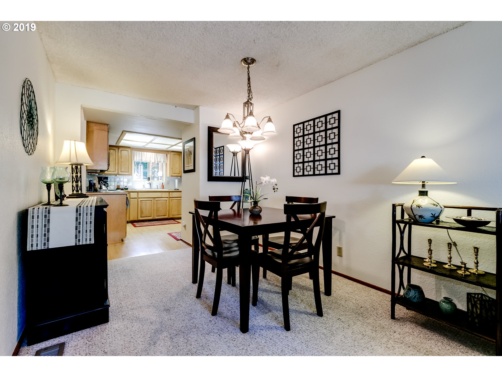 537 66th Street Springfield, OR 97478 - Photo 9 of 32 a view of a dining room with furniture and chandelier