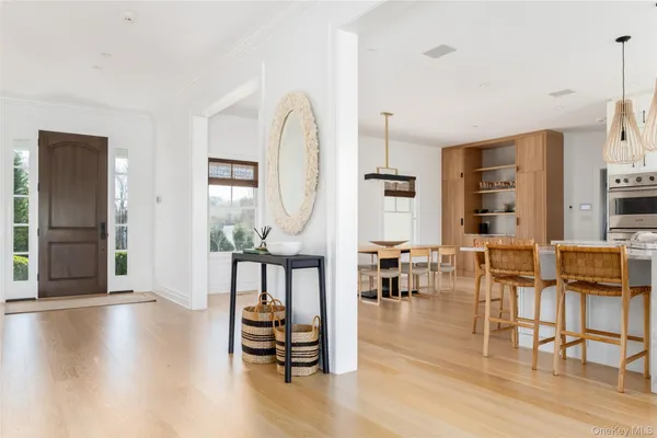 a living room with fireplace furniture and a wooden floor