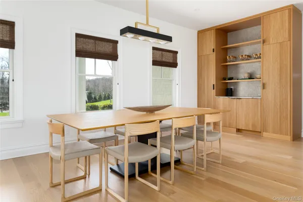 a view of a dining room with furniture and window
