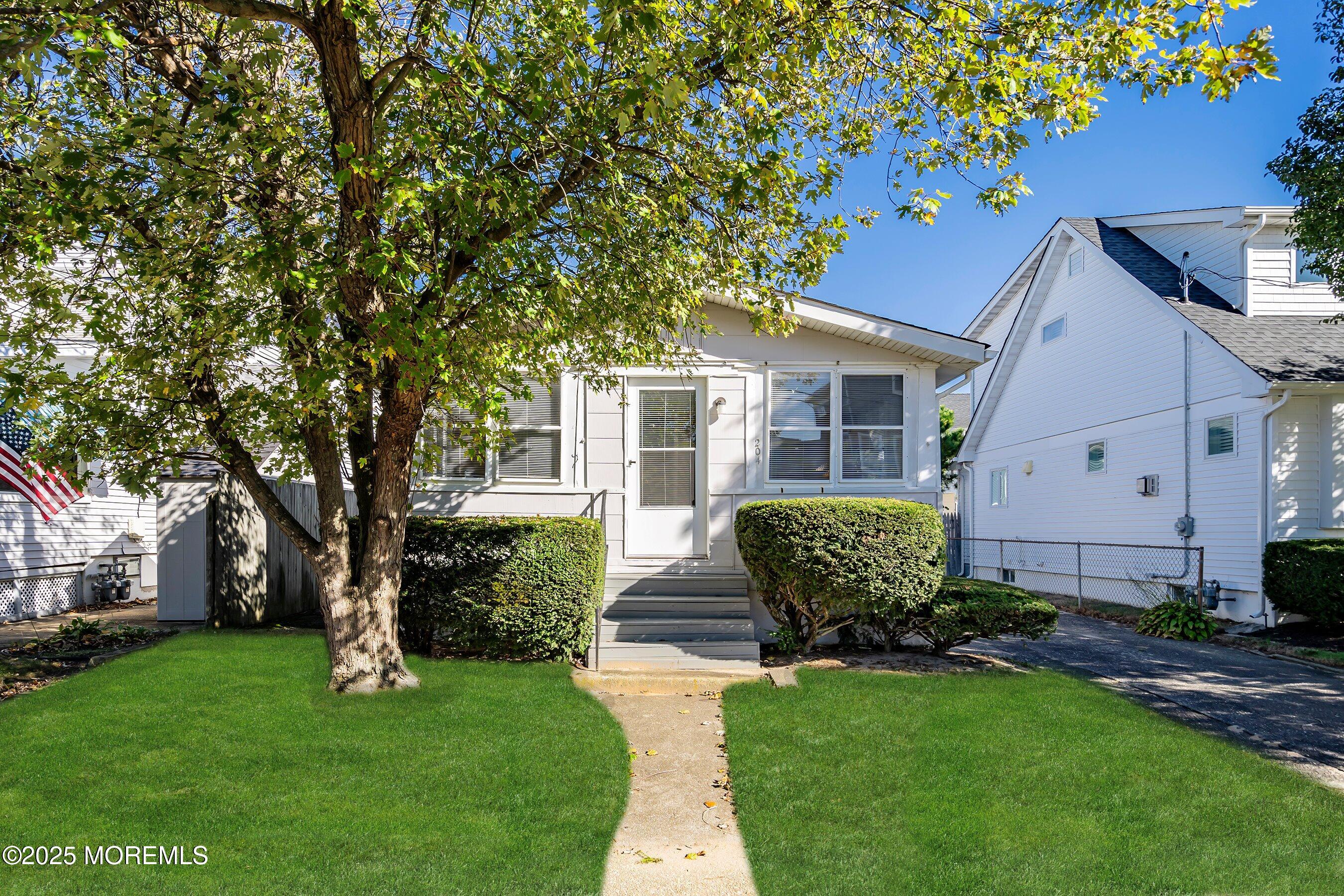 204 19th Avenue Belmar, NJ 07719 - Photo 1 of 24 a front view of a house with garden