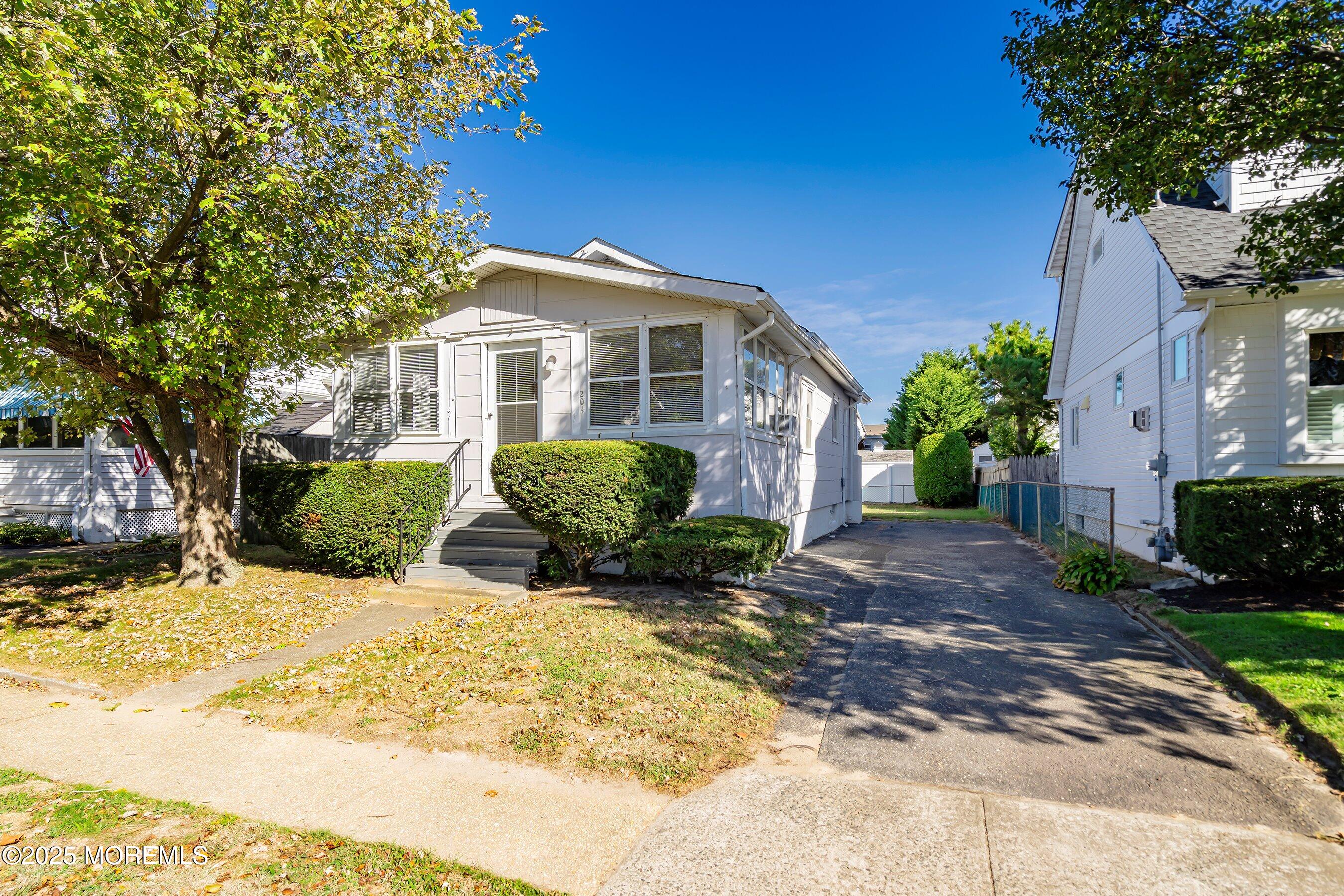 204 19th Avenue Belmar, NJ 07719 - Photo 4 of 24 a view of a house with a yard
