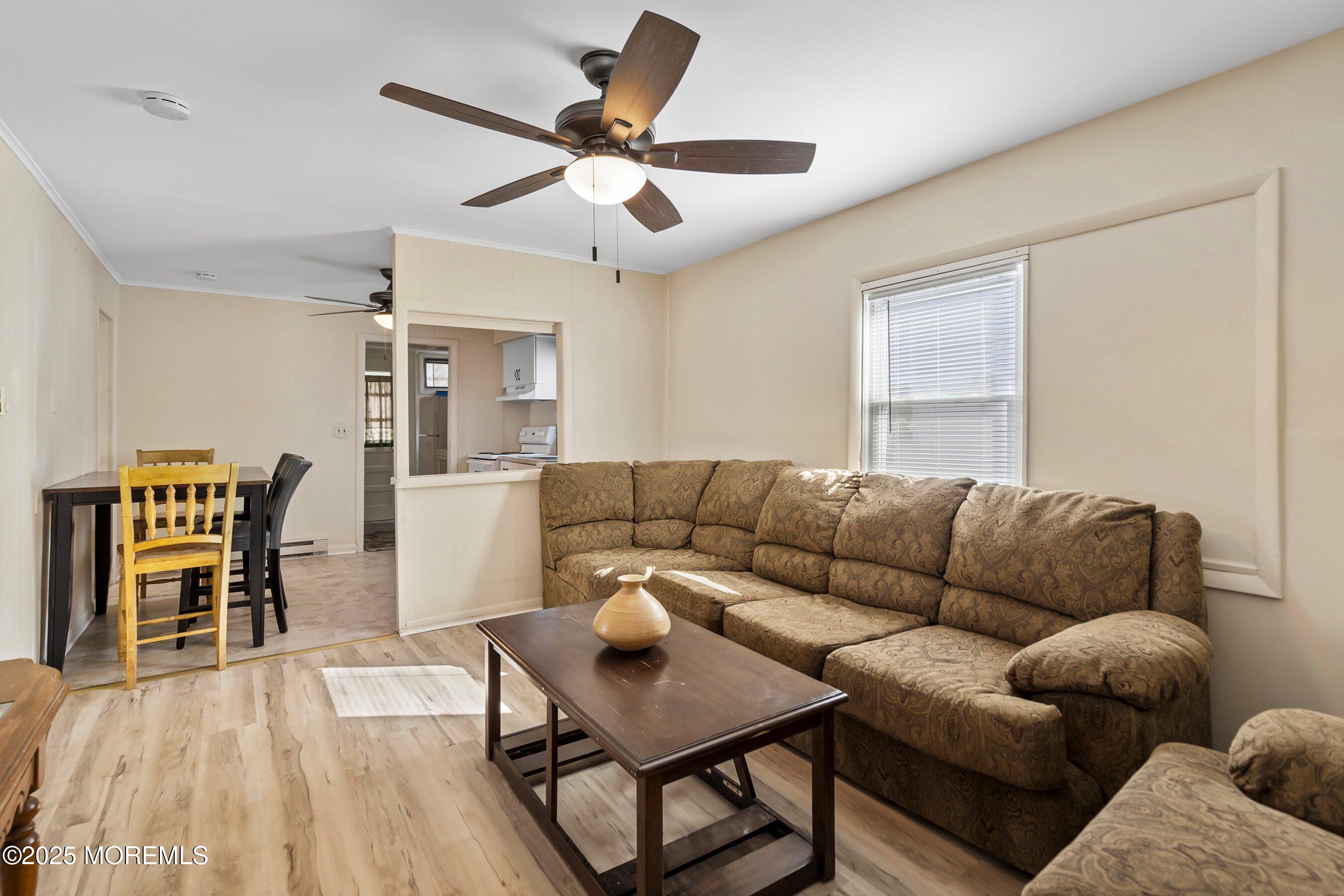 204 19th Avenue Belmar, NJ 07719 - Photo 6 of 24 a living room with furniture wooden floor and a window