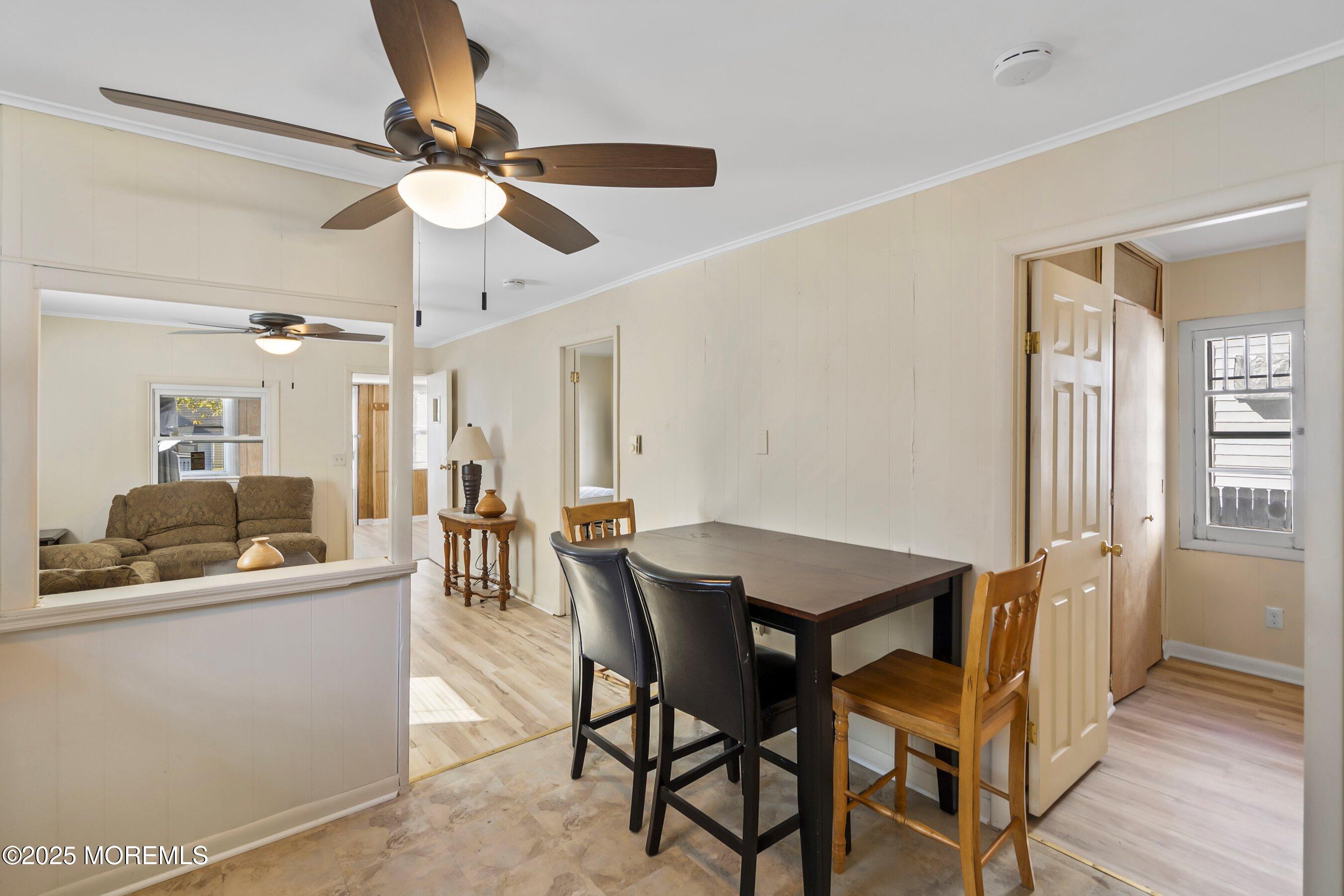 204 19th Avenue Belmar, NJ 07719 - Photo 8 of 24 a view of a dining room with furniture and a chandelier
