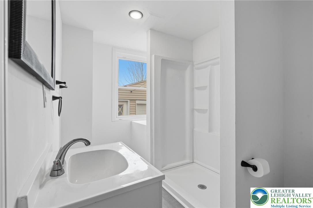 46 West Garrison Street Bethlehem, PA 18018 - Photo 11 of 39 a bathroom with a sink and mirror