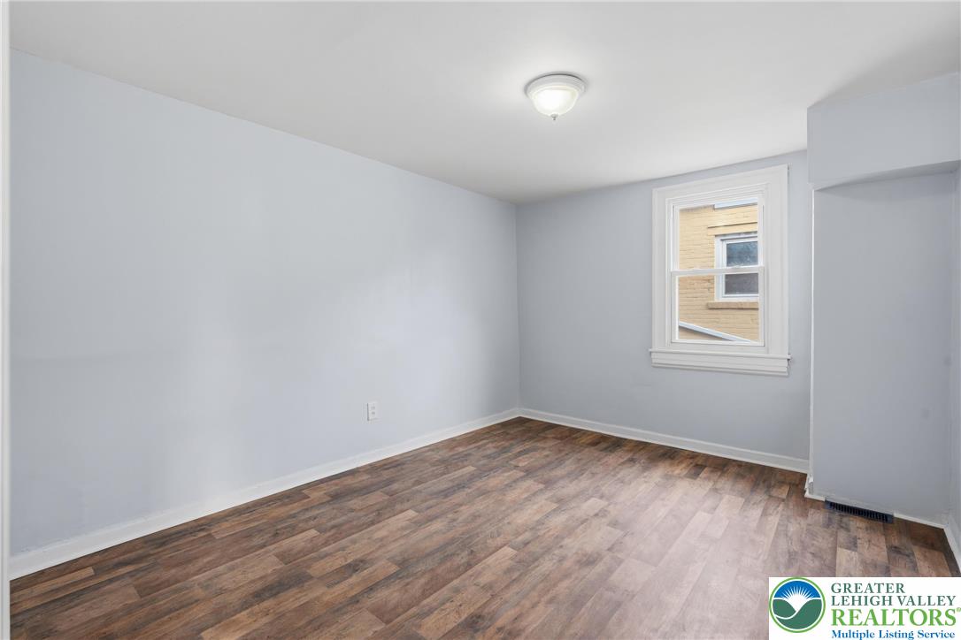 46 West Garrison Street Bethlehem, PA 18018 - Photo 14 of 39 a view of an empty room with wooden floor and a window