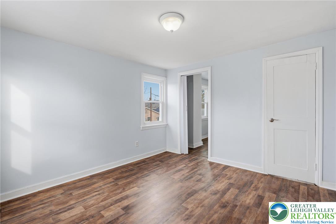 46 West Garrison Street Bethlehem, PA 18018 - Photo 16 of 39 an empty room with wooden floor and windows