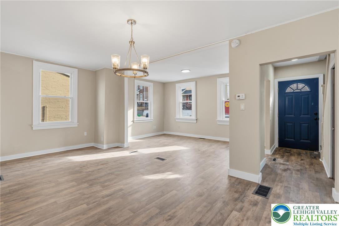 46 West Garrison Street Bethlehem, PA 18018 - Photo 3 of 39 an empty room with wooden floor and windows