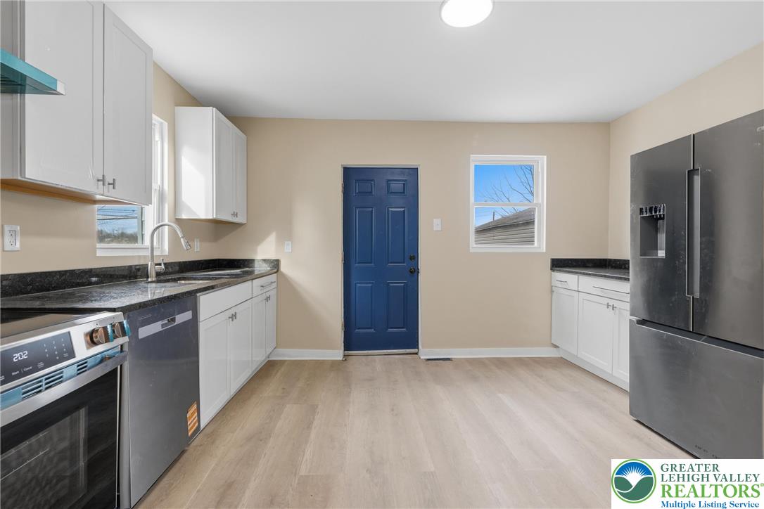 46 West Garrison Street Bethlehem, PA 18018 - Photo 7 of 39 a kitchen with stainless steel appliances granite countertop a refrigerator and a stove top oven