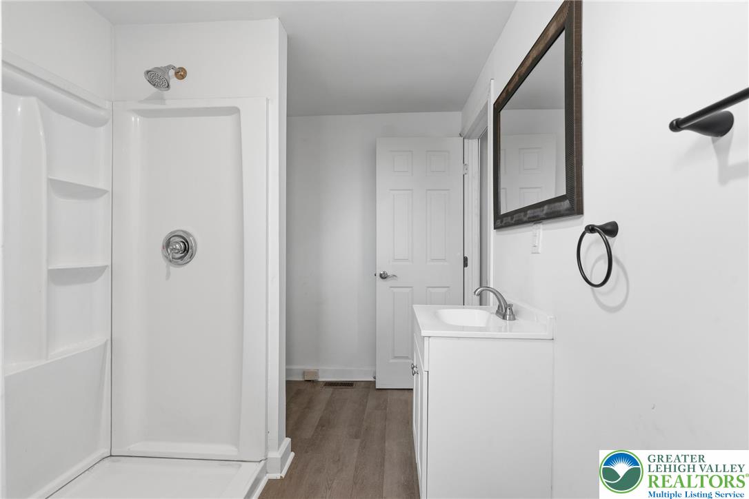 46 West Garrison Street Bethlehem, PA 18018 - Photo 10 of 39 a bathroom with a sink and a mirror