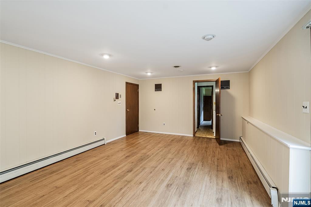 5-03 River Road Fair Lawn, NJ 07410 - Photo 15 of 21 a view of an empty room with wooden floor
