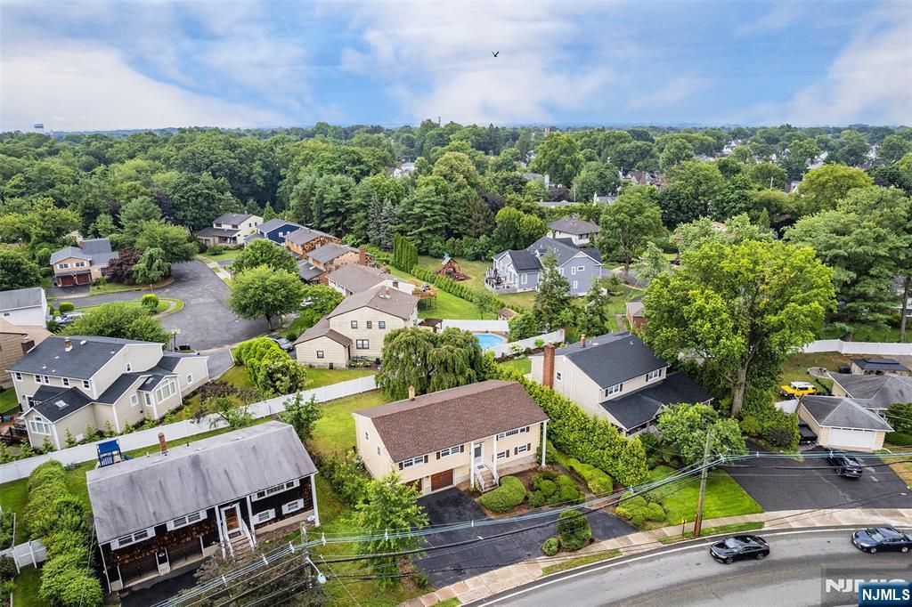 5-03 River Road Fair Lawn, NJ 07410 - Photo 2 of 21 an aerial view of a house with garden space and street view