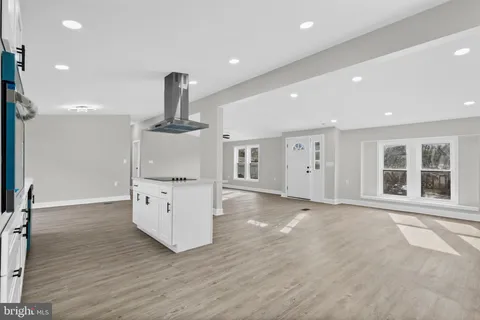 a kitchen with stainless steel appliances granite countertop a stove and a refrigerator