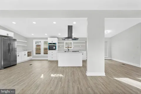 a view of kitchen with stainless steel appliances refrigerator oven and stove