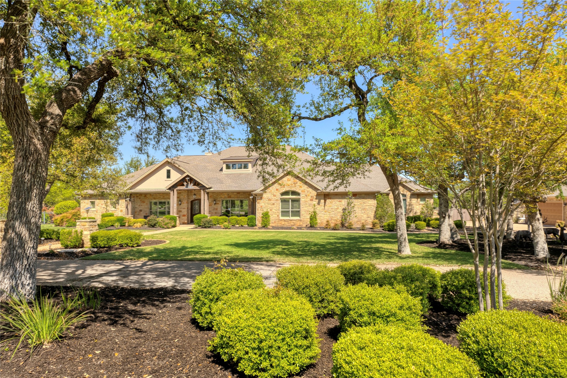 204 Vista Lane Georgetown, TX 78633 - Photo 1 of 1 Nestled within the serene meticulously landscaped two-acre estate in a gated community, lies a single-story four-bedroom, five-and-a-half-bathroom 6,662 SF of Texas size Living Space.