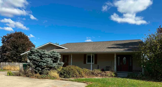 a view of a house with garden and plants