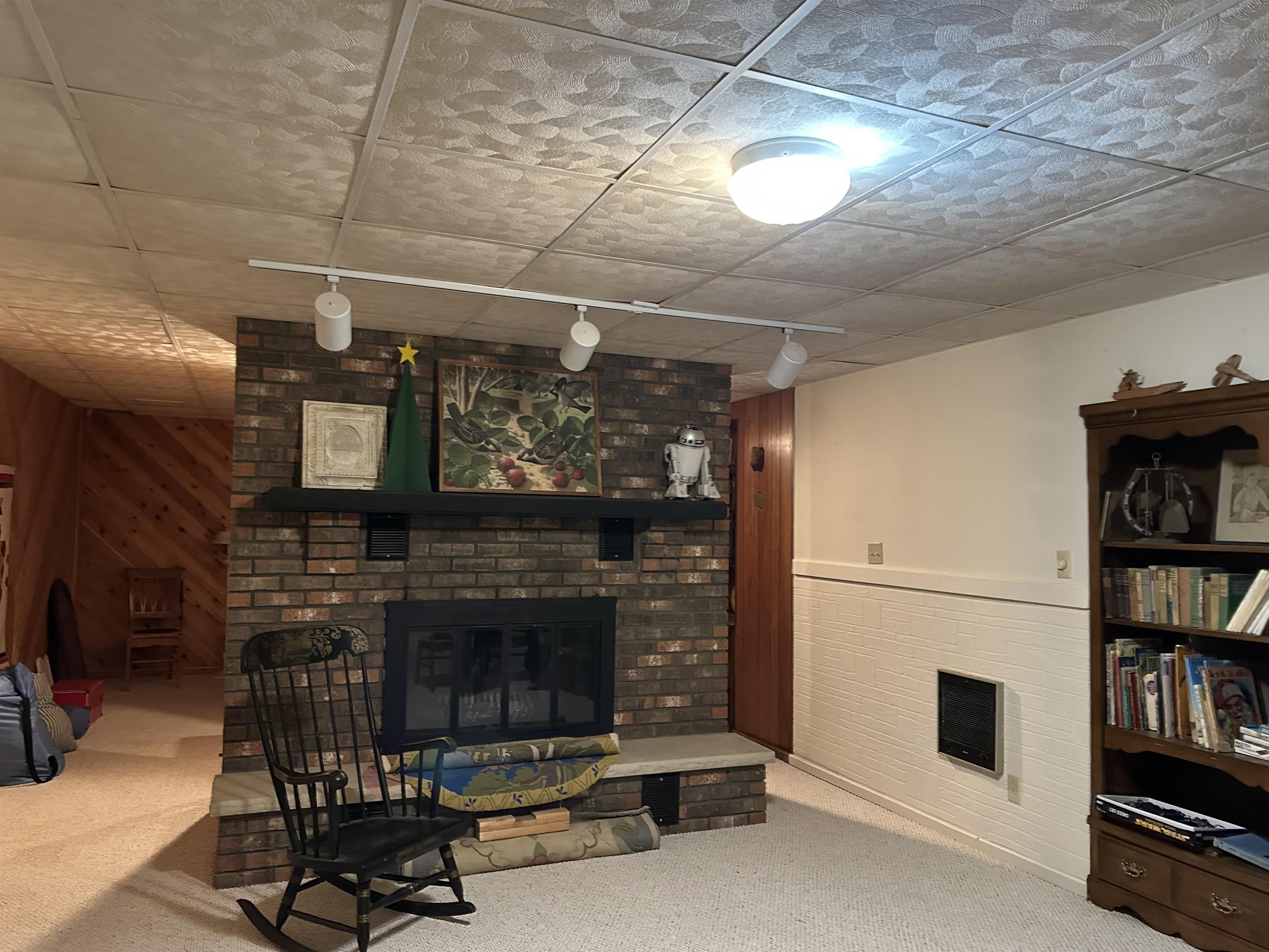 16529 Scenic Palisades Road Mount Carroll, IL 61053 - Photo 20 of 39 a living room with furniture a flat screen tv and a fireplace