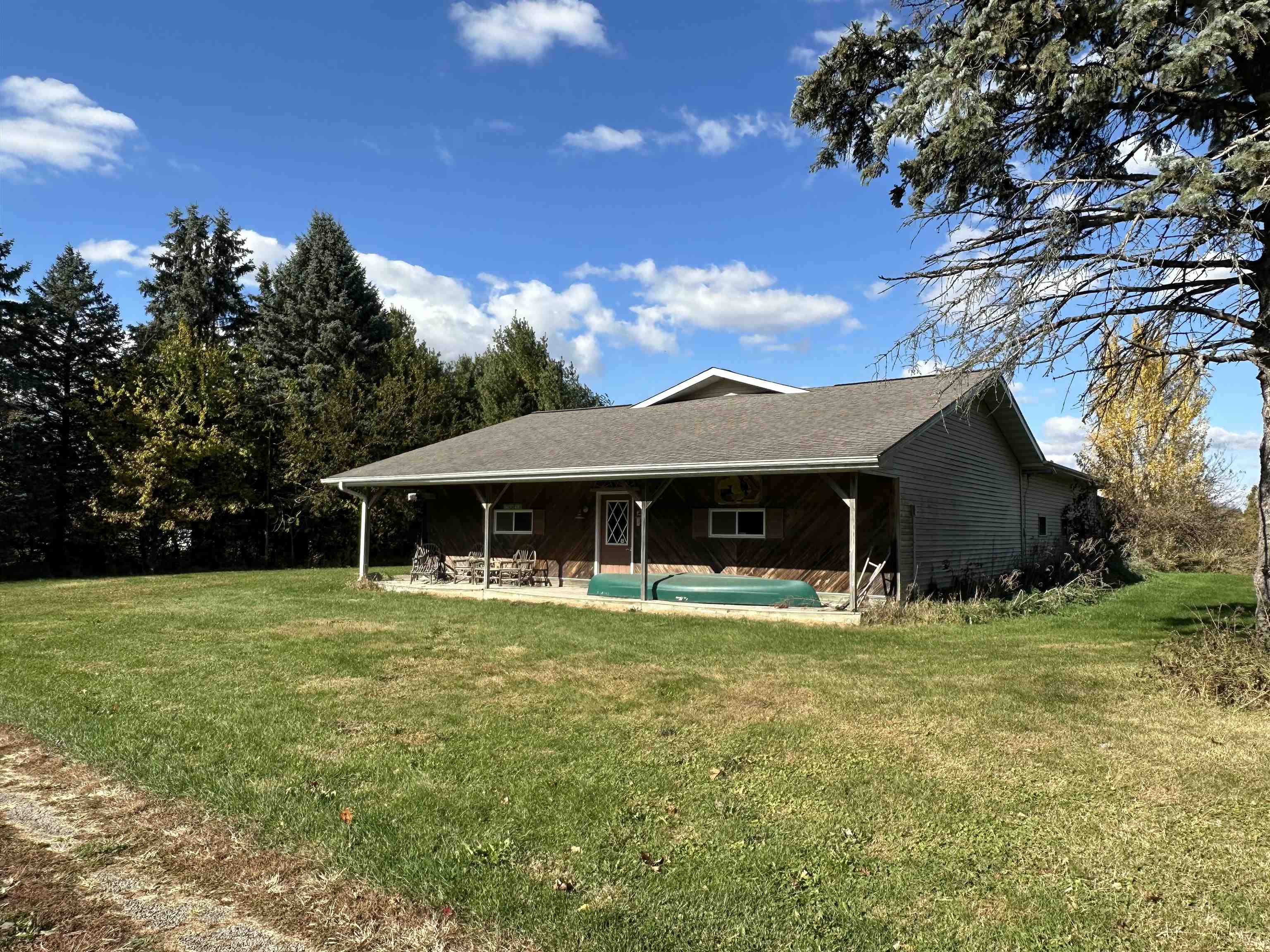 16529 Scenic Palisades Road Mount Carroll, IL 61053 - Photo 2 of 39 a house view with a garden space